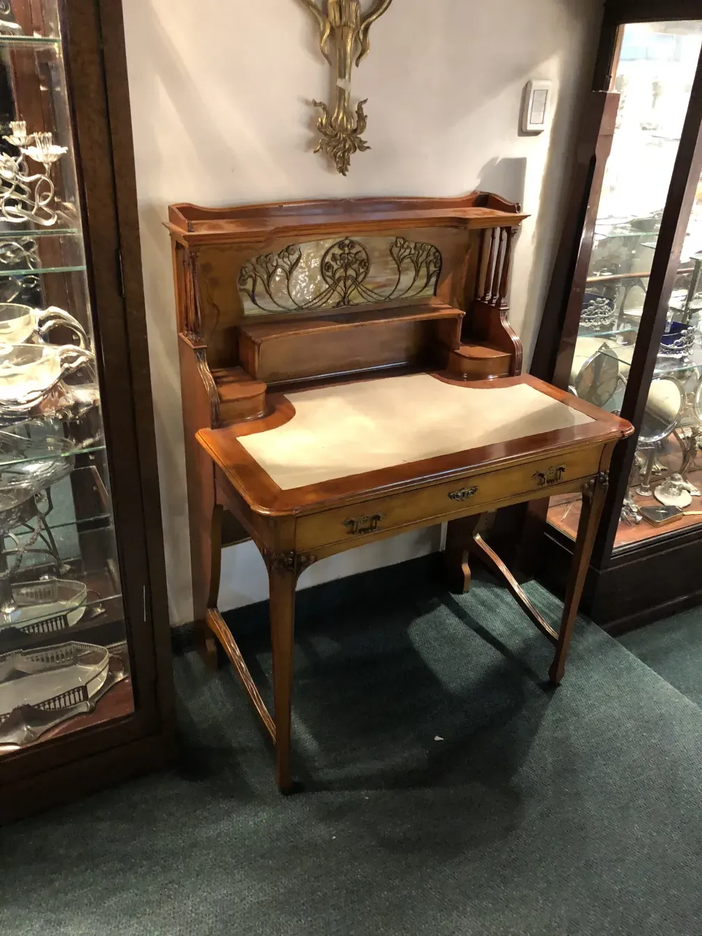 antique wooden desk with light floral decor, in a cozy environment