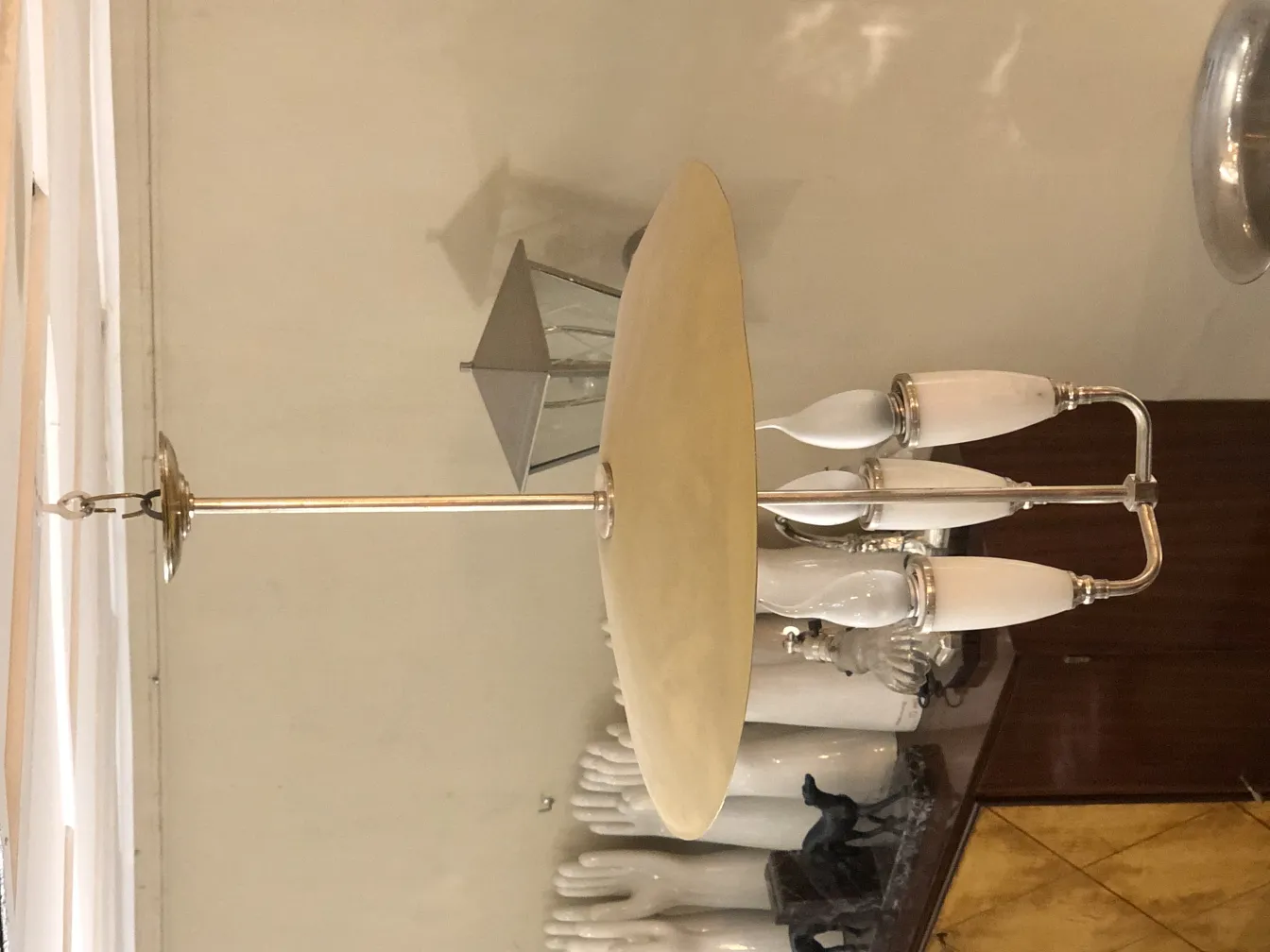 Antique hanging lamp with elegant arms and details.