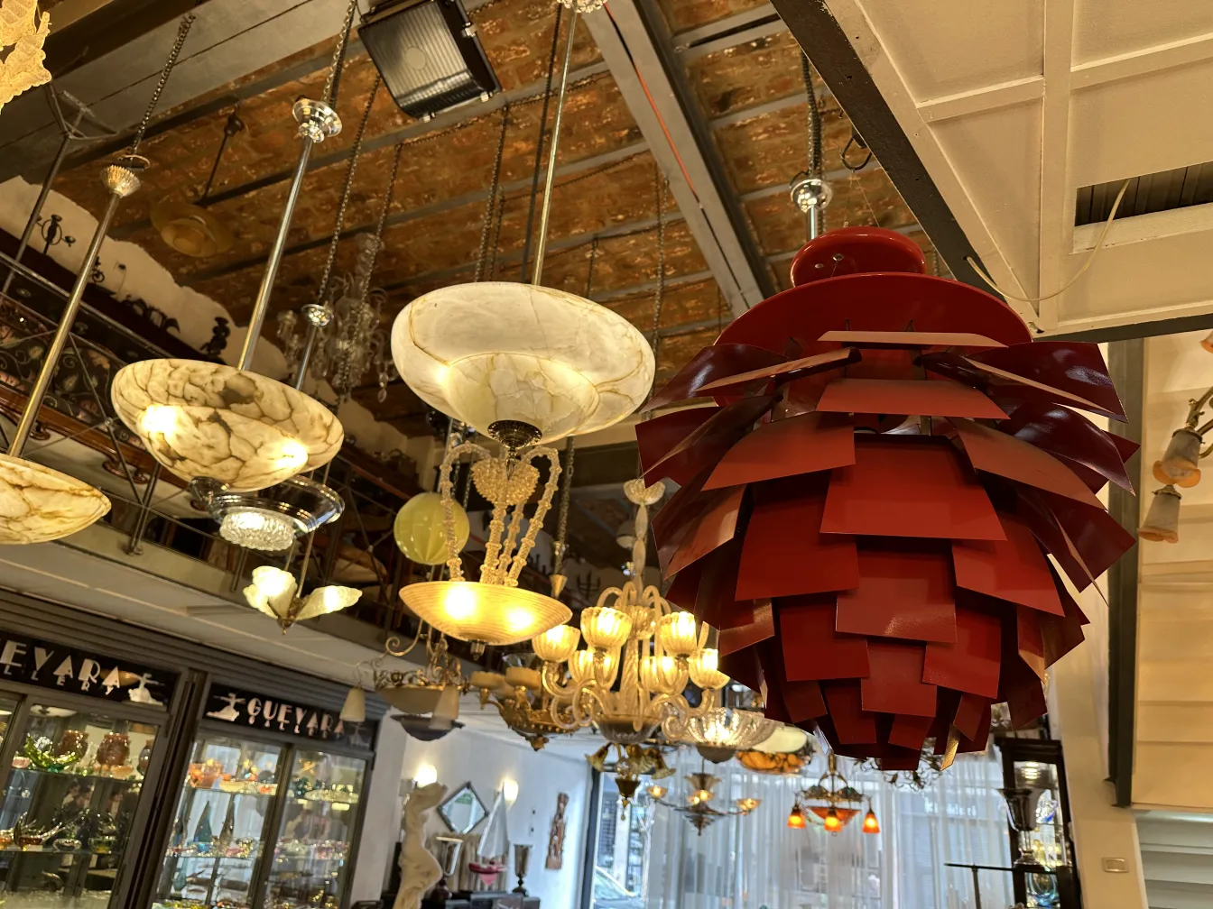 Antique hanging lamp by Poul Henningsen with a unique and colorful design, suspended in a classic setting.