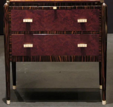 Antique desk with two drawers in a sophisticated setting.