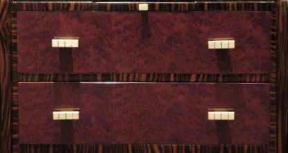 Antique desk with two burgundy drawers.