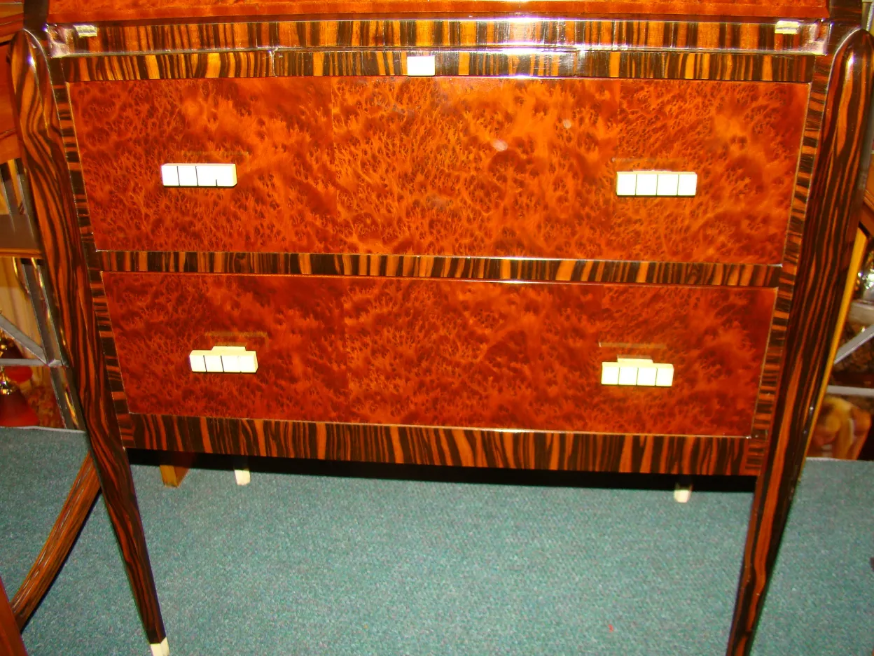 Antique desk with a glossy finish and two front drawers.