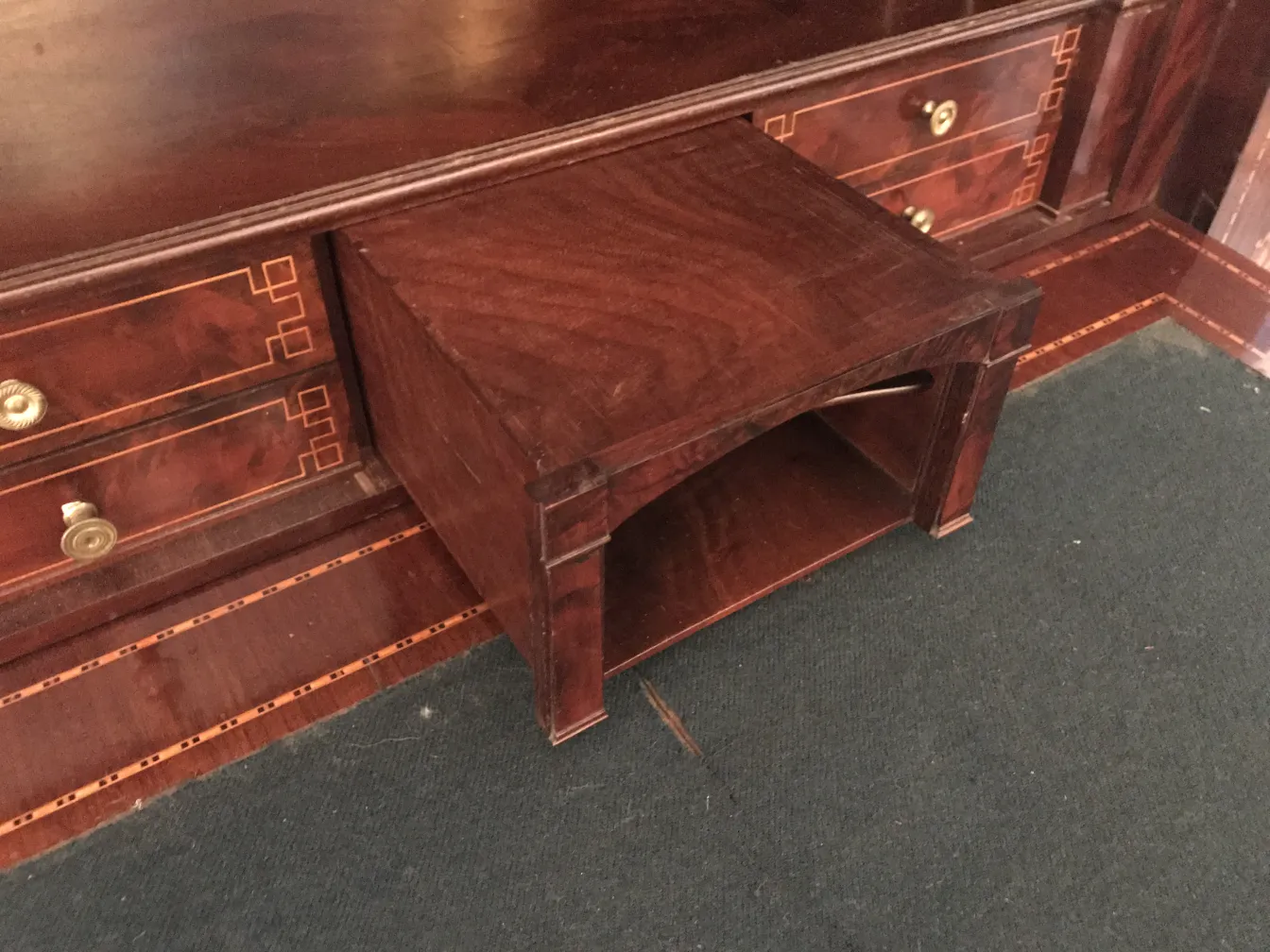 Antique desk with storage space underneath, brown background