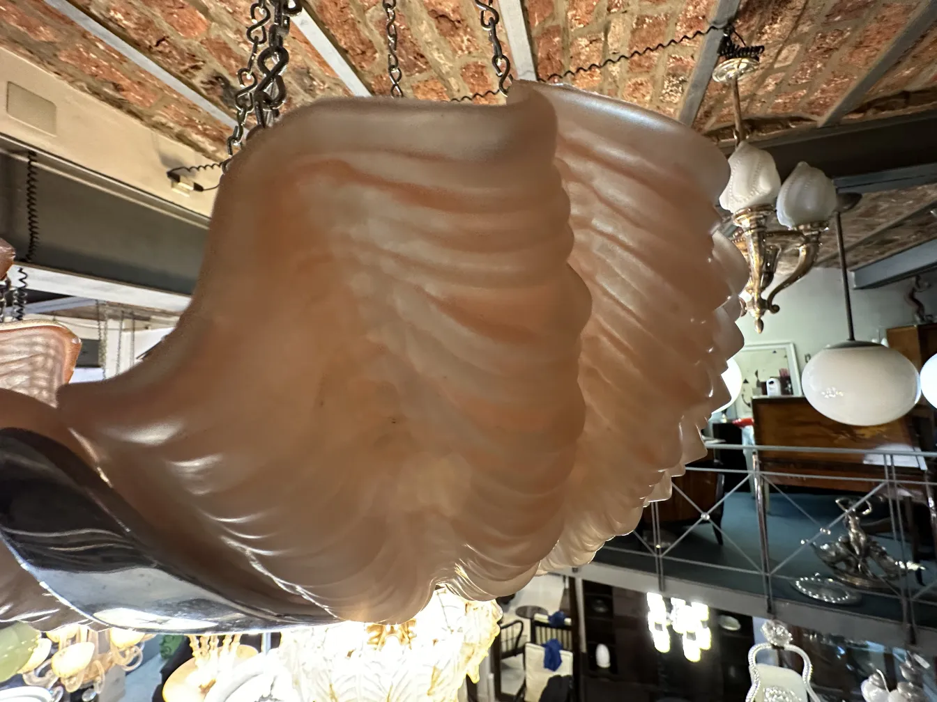 Antique hanging lamp with curved design in cozy setting