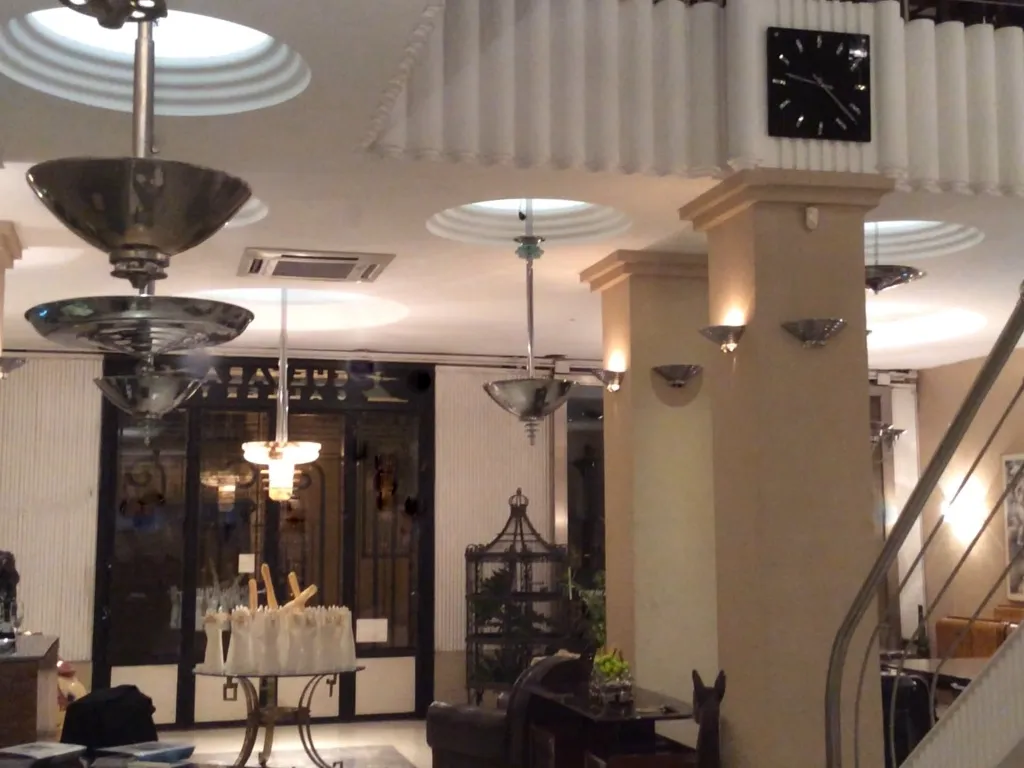 Antique hanging lamp in an elegant setting, with visible details and shadows