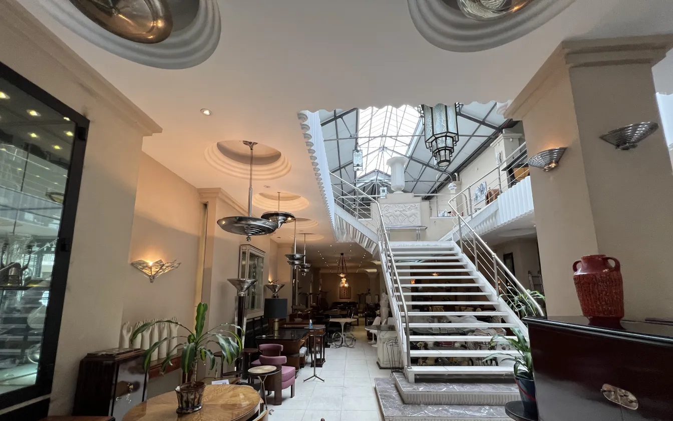 Antique hanging lamp in an elegant living space with stairs