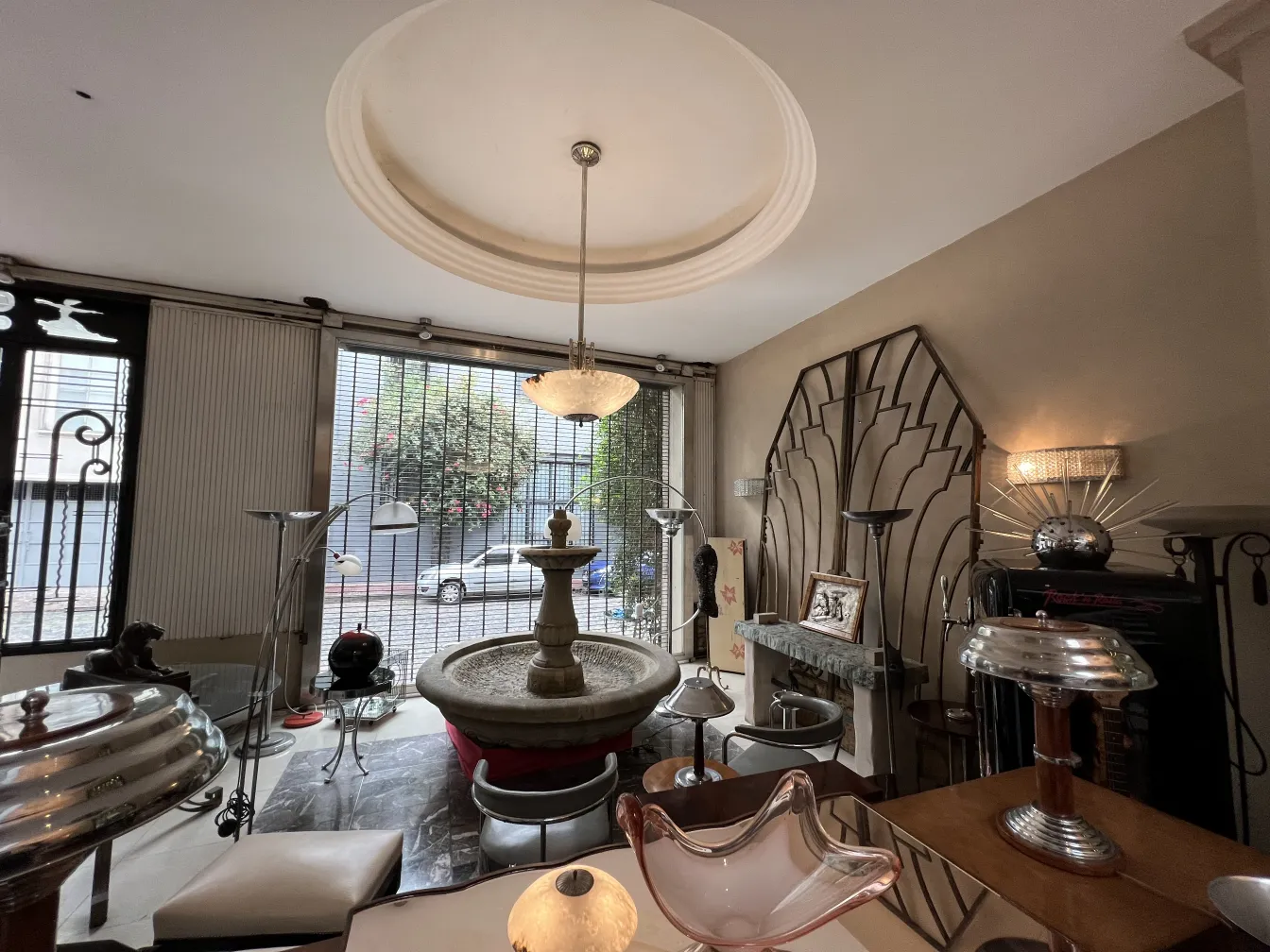 Antique hanging lamp illuminating an elegant room with accessories.