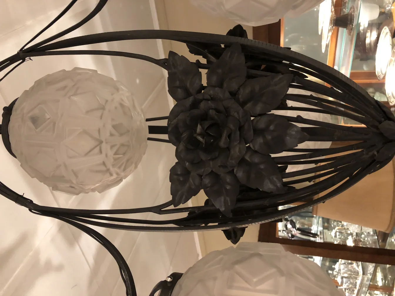 Antique hanging lamp with rose details and elegant finish.