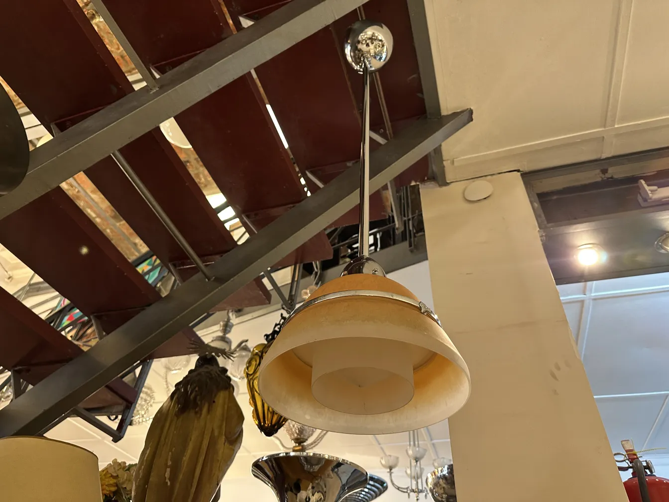 Antique hanging lamp with elegant finish, suspended.