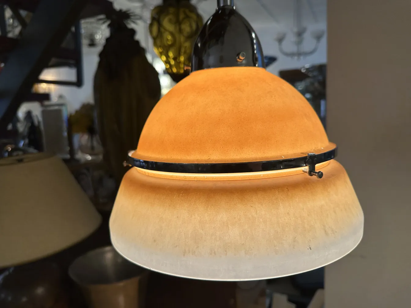 Antique hanging lamp with elegant design in a cozy setting.