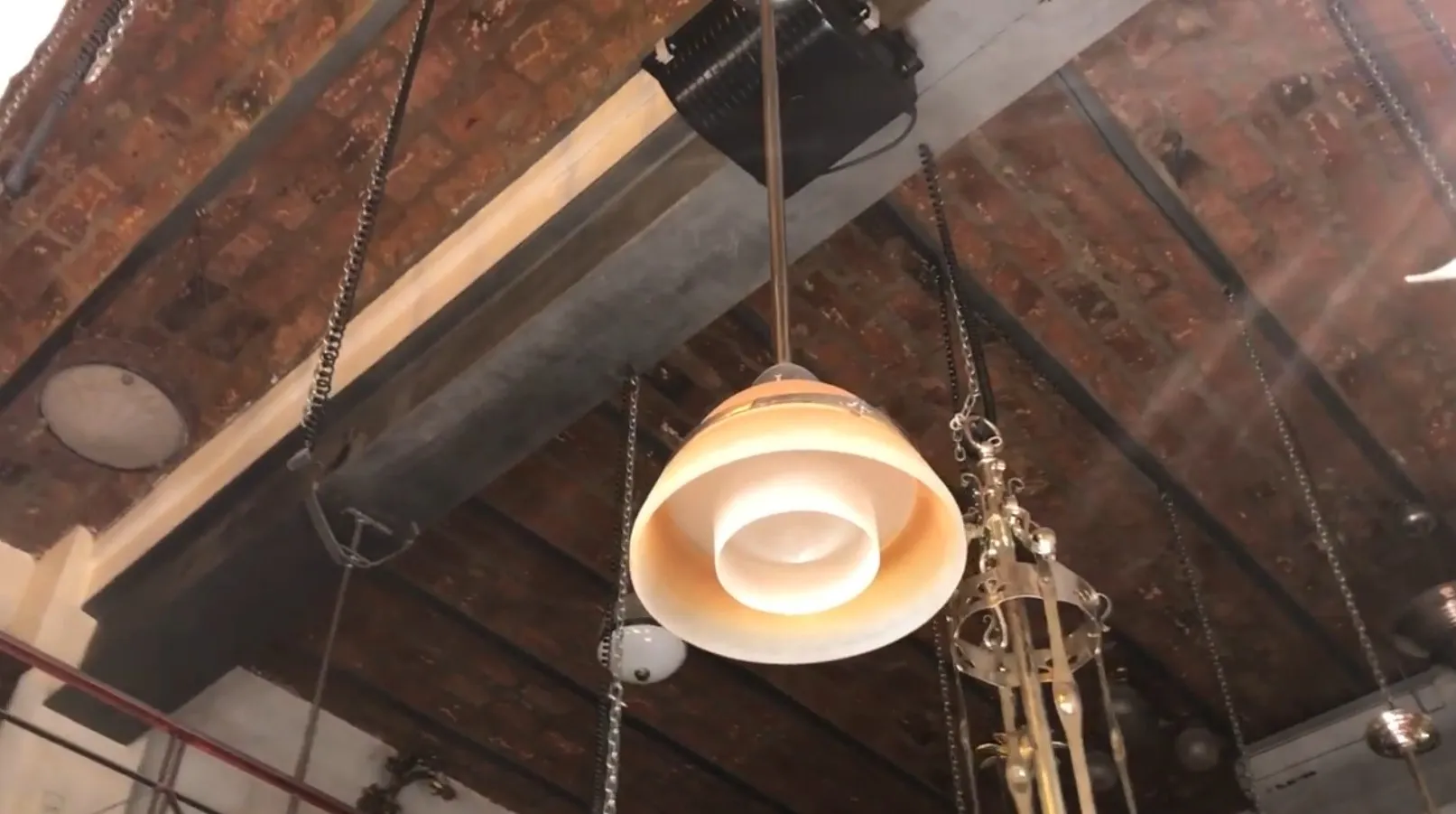 Antique glass hanging lamp in a rustic setting