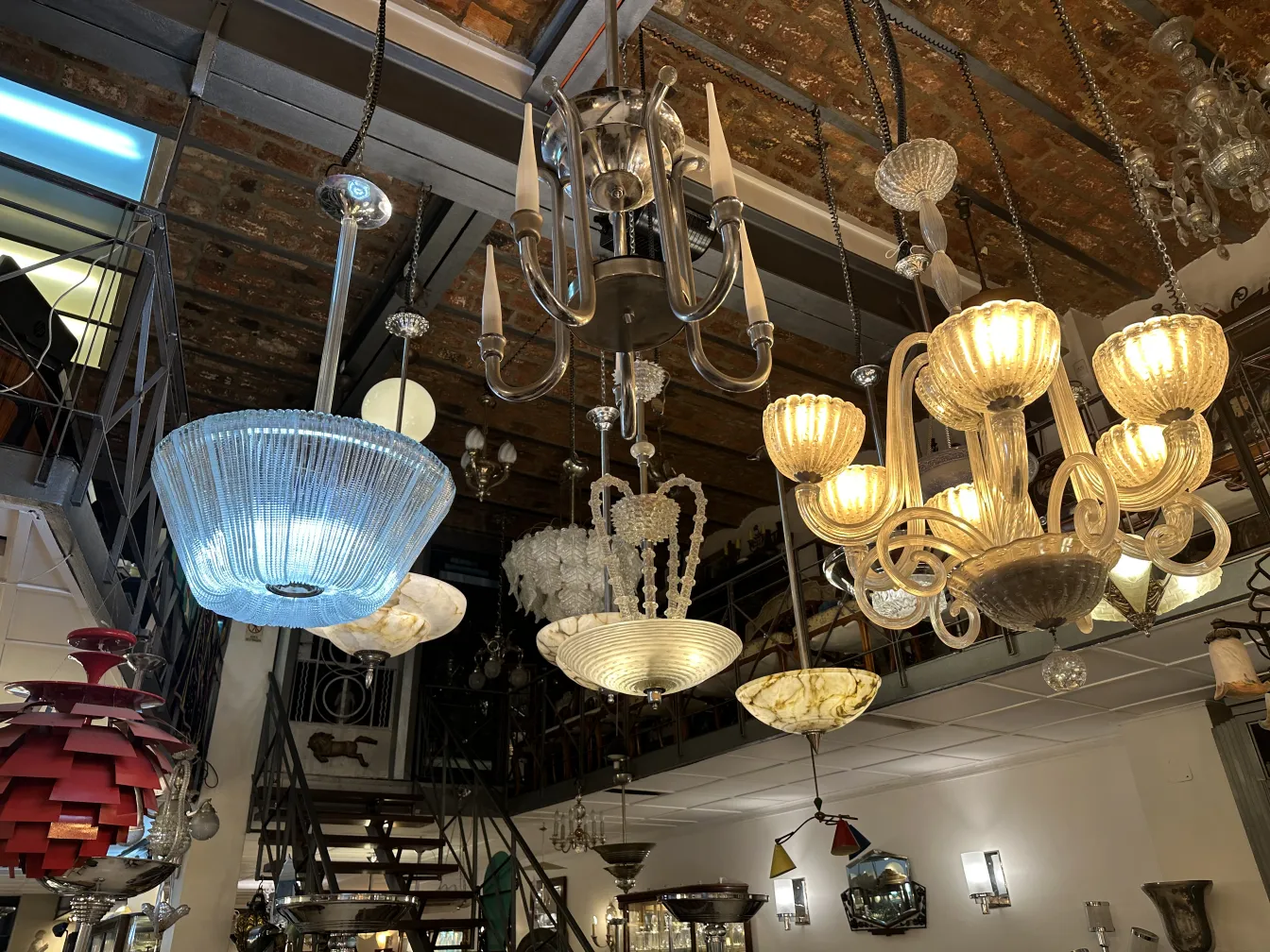 Antique hanging lamp made of glass in a decorative setting.