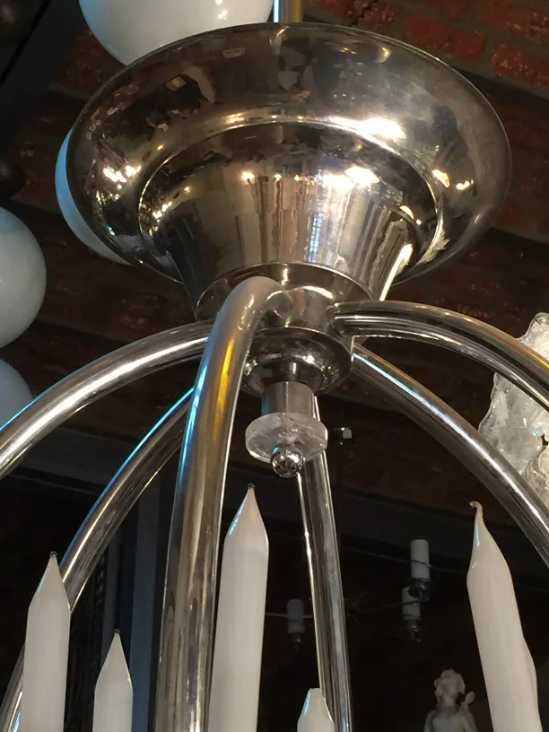 Antique hanging lamp with white candle-like lights and shining finish