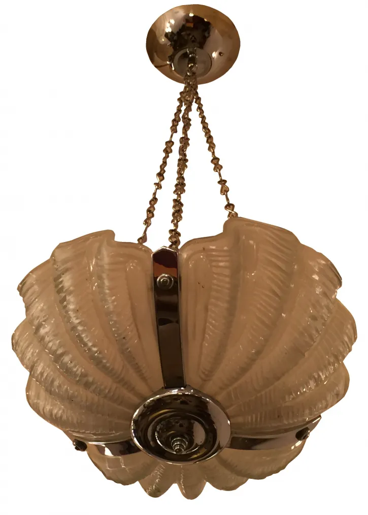Antique hanging lamp with relief design in a light color, in a cozy atmosphere.