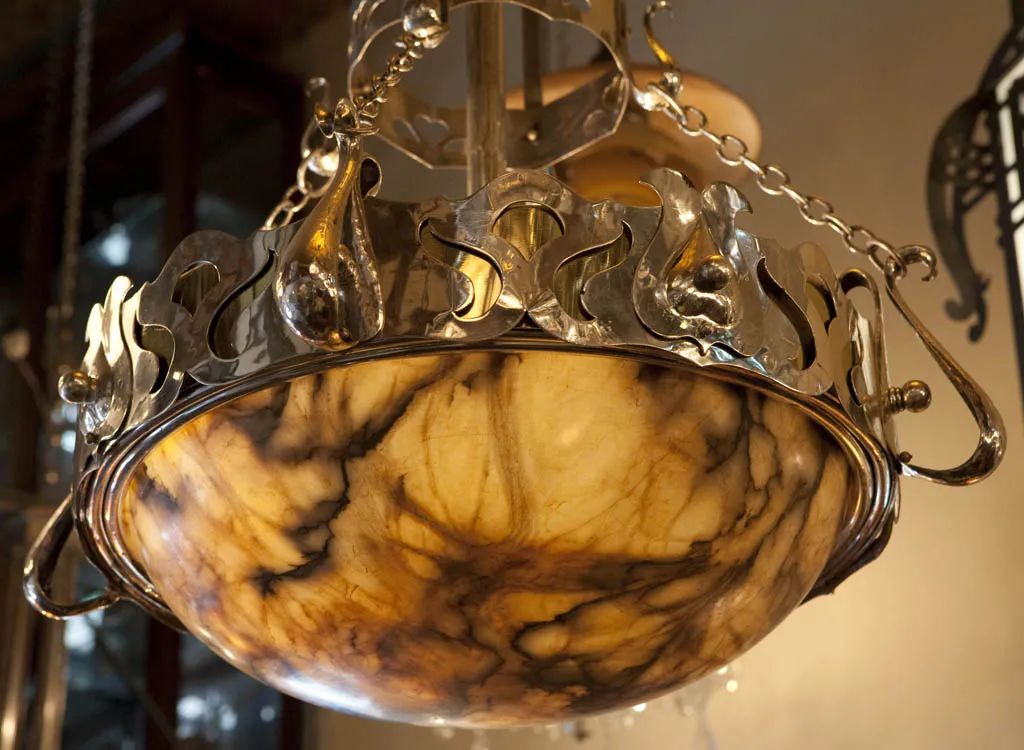 Antique hanging lamp with classic design and decorative details.