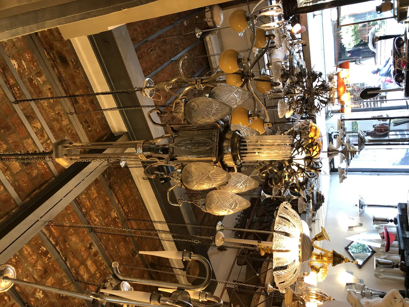 Antique hanging lamp with bright lights and flower decorations.