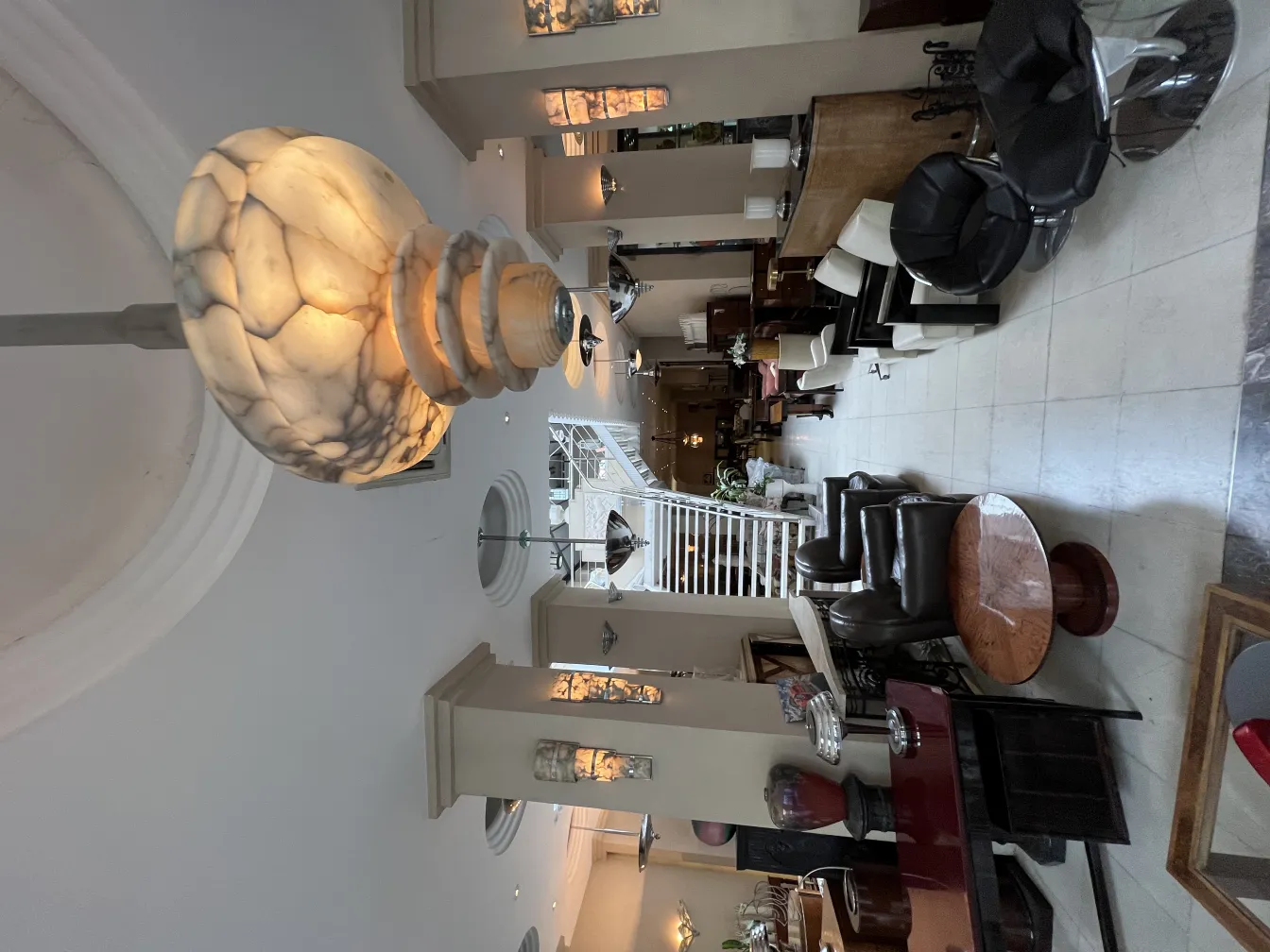 Antique hanging lamp with rounded shape illuminating a living room