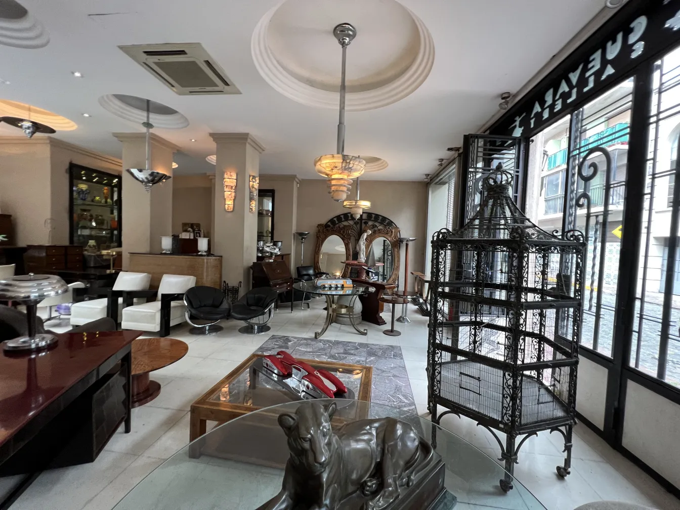 Antique decorative hanging lamp in an elegant setting with various furniture