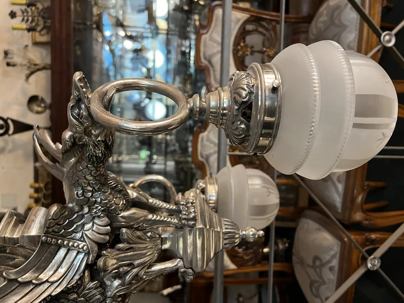 Antique hanging lamp with gold designs in the background