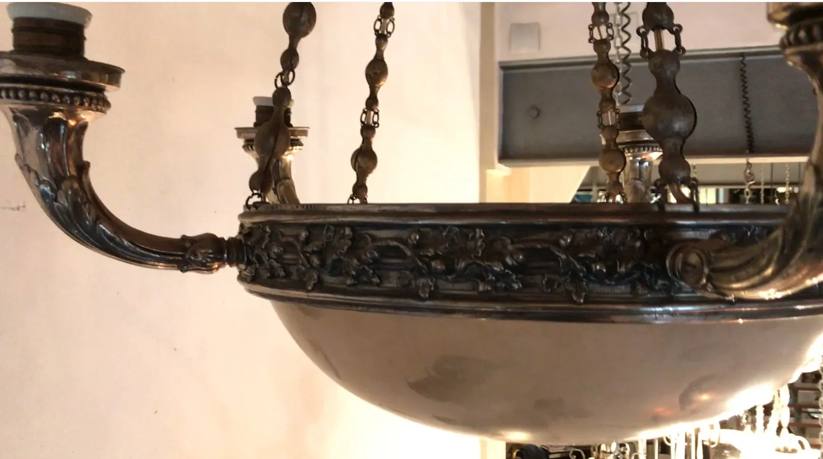 Antique hanging lamp with decorative details in a classic setting.