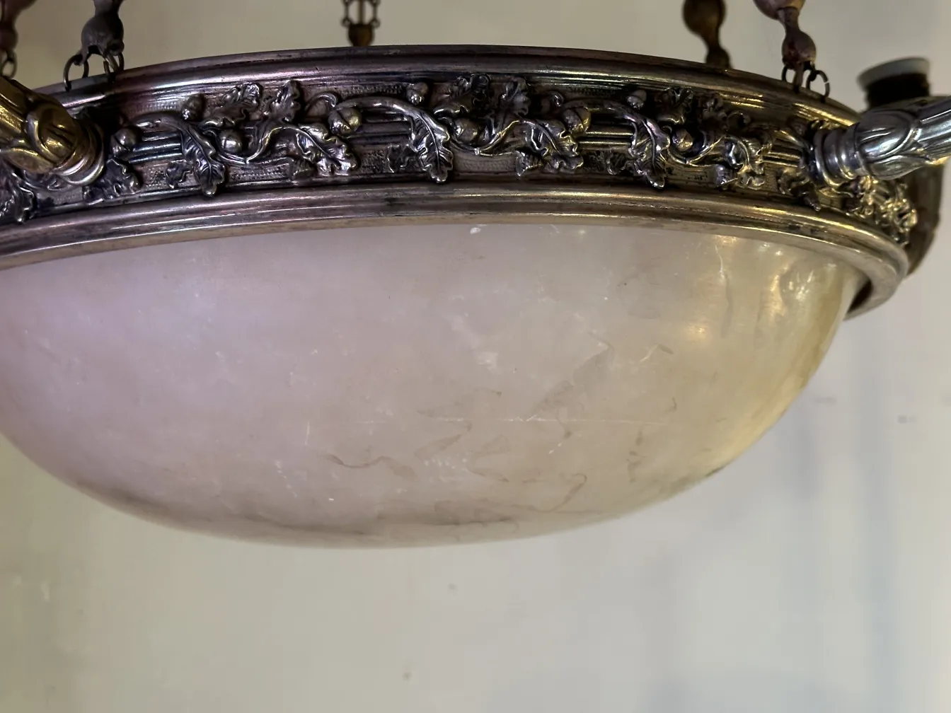 Antique hanging lamp with intricate ornamentation and an elegant finish.