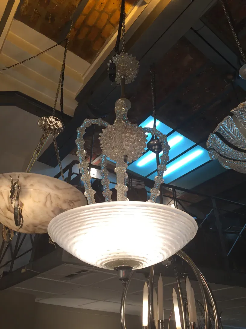 Antique hanging lamp with decorative details, elegant setting.