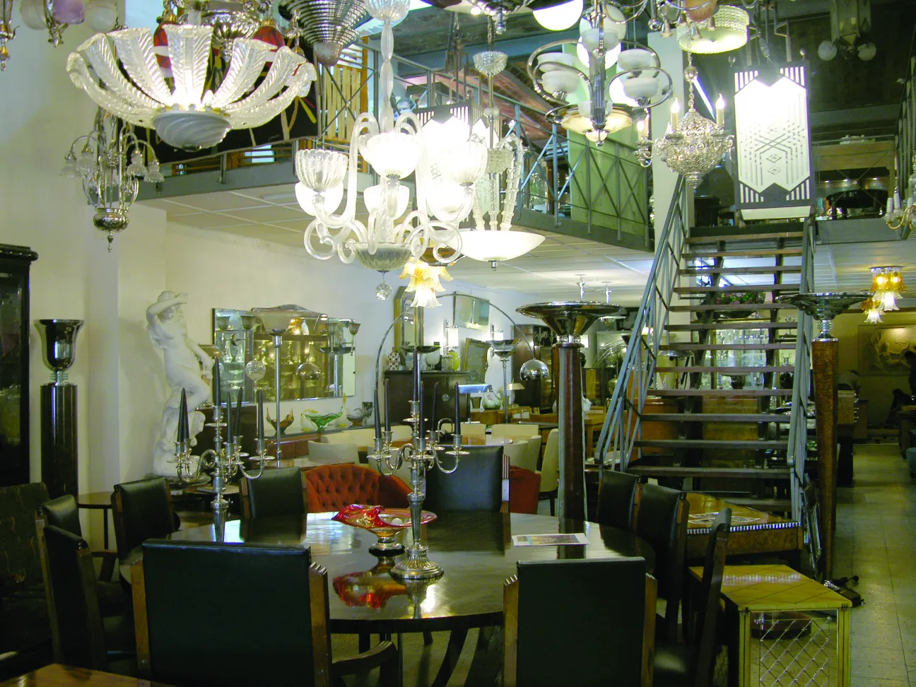 Antique hanging lamp illuminating an elegant dining area with chandeliers.