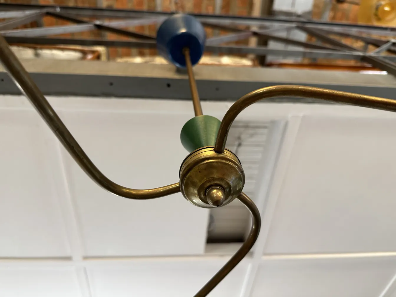 Antique hanging lamp featuring decorative metal details.