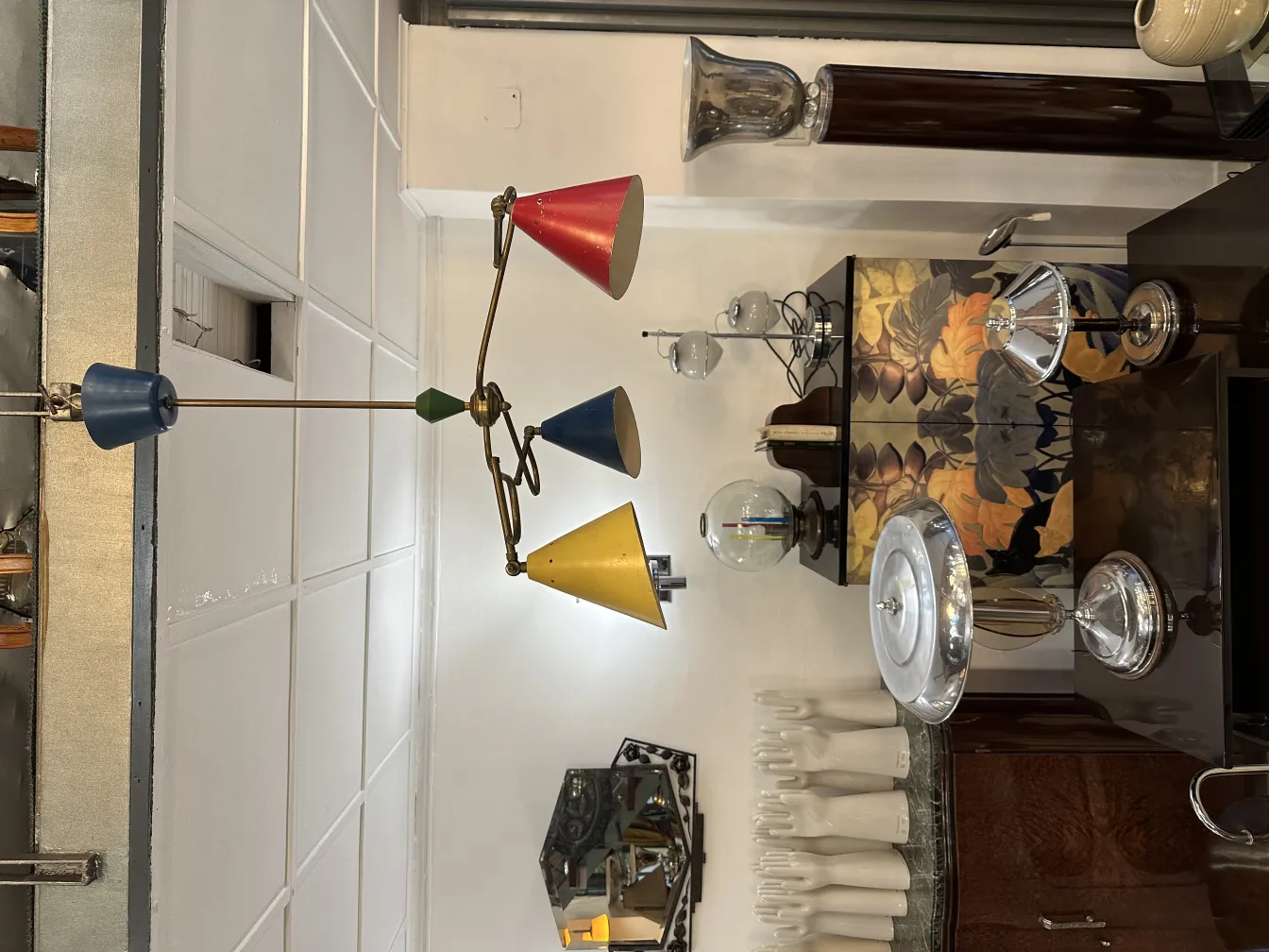 Antique hanging lamp with bright colored lights in a stylish setting.