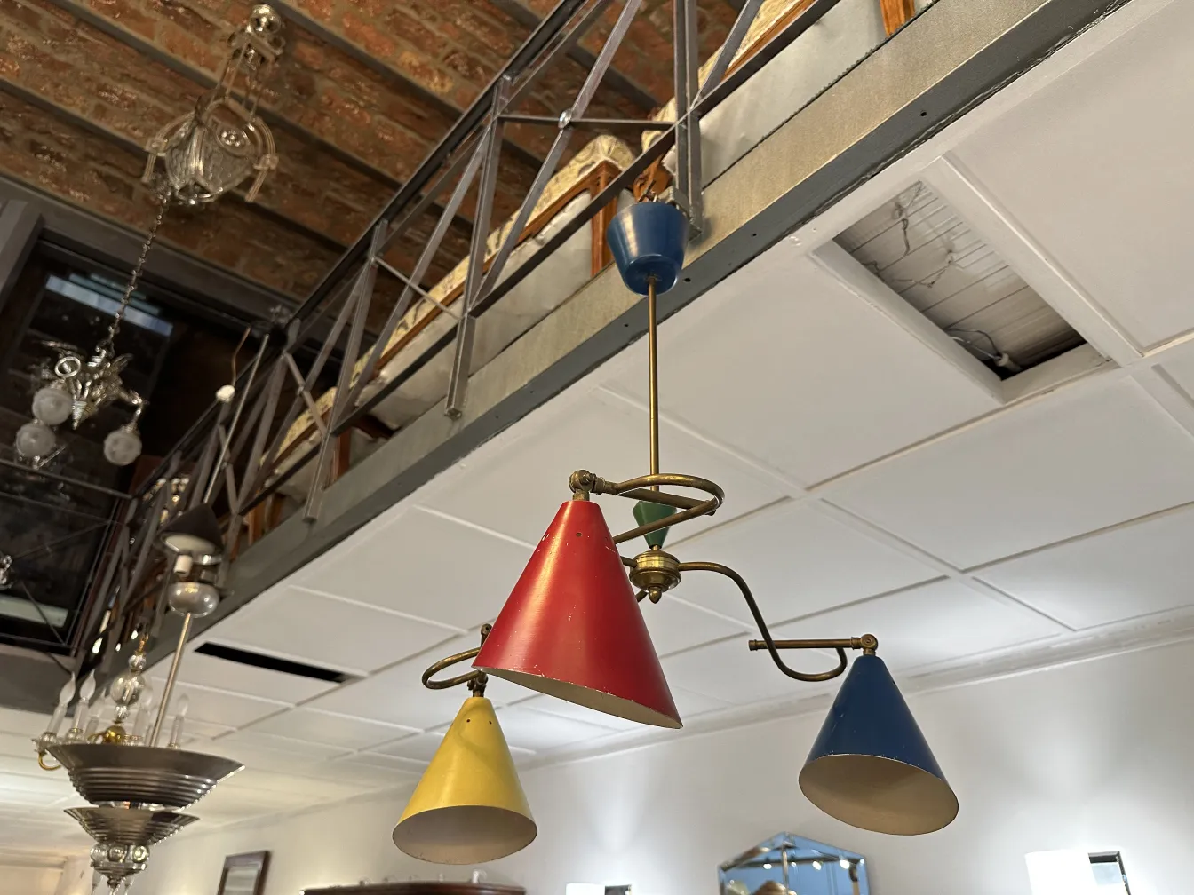 antique hanging lamp with colorful cone shapes in a modern setting