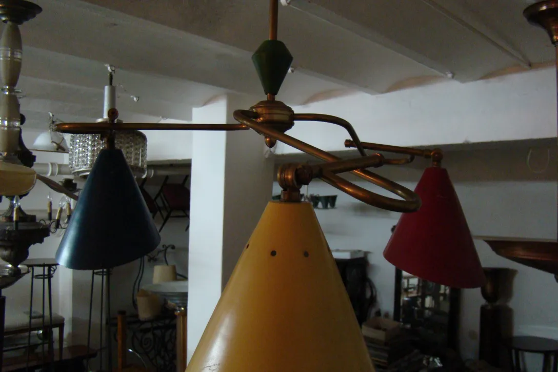 hanging lamp with colorful shapes in an antique setting