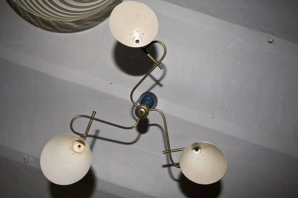 antique hanging lamp with three curved lights