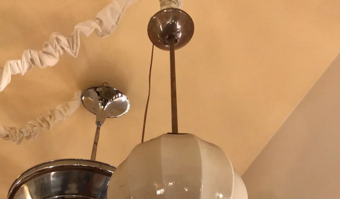 Antique hanging lamp with classic design, bright illumination.