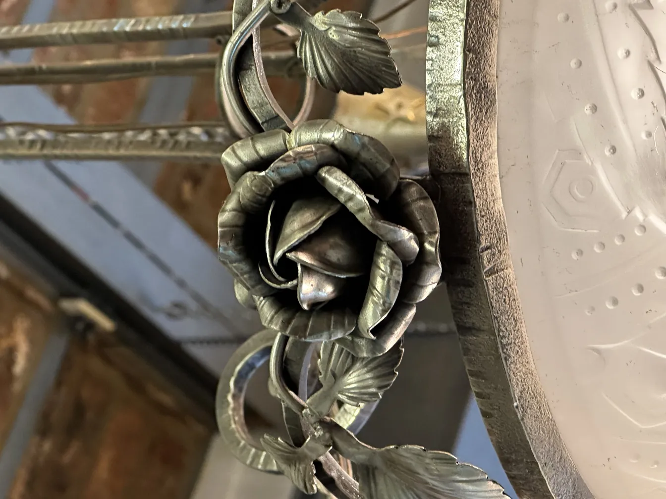 antique hanging lamp with metal roses, intricate design.