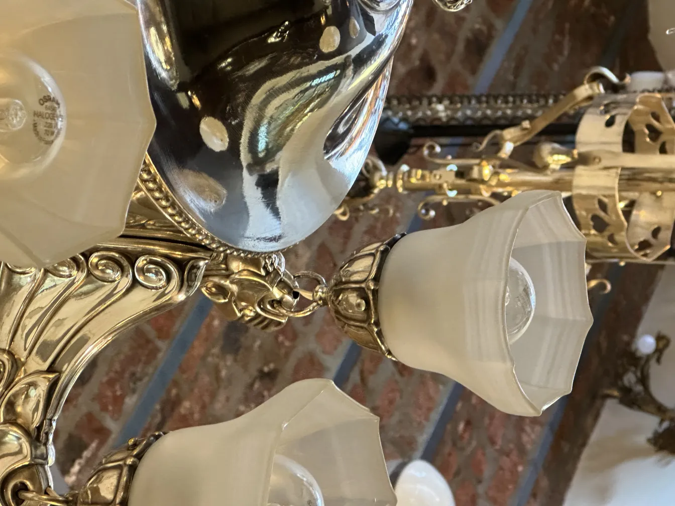 Antique hanging lamp with glass details and shine, elegant environment.