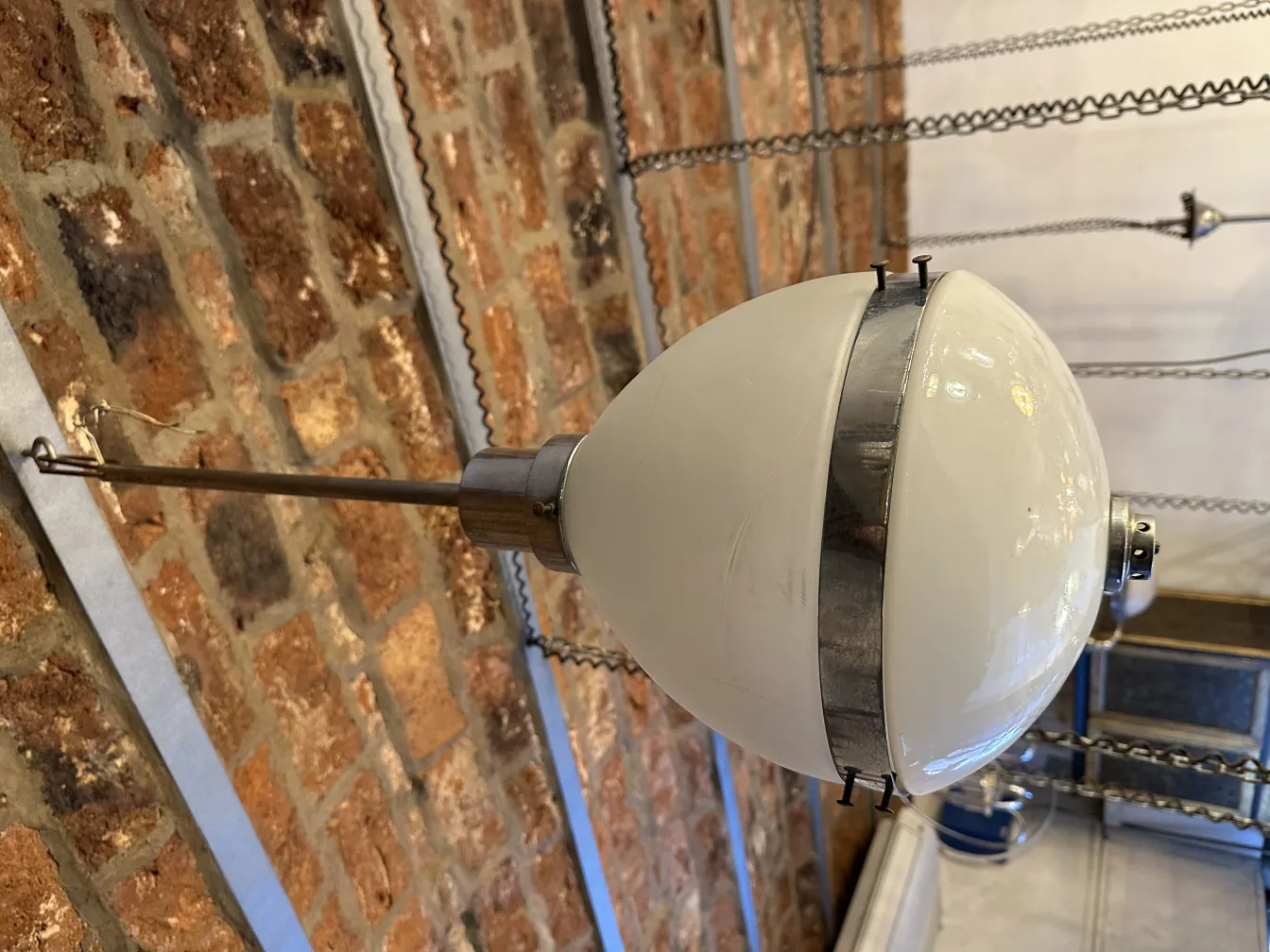 Antique hanging lamp with a spherical design, perfect for decor.