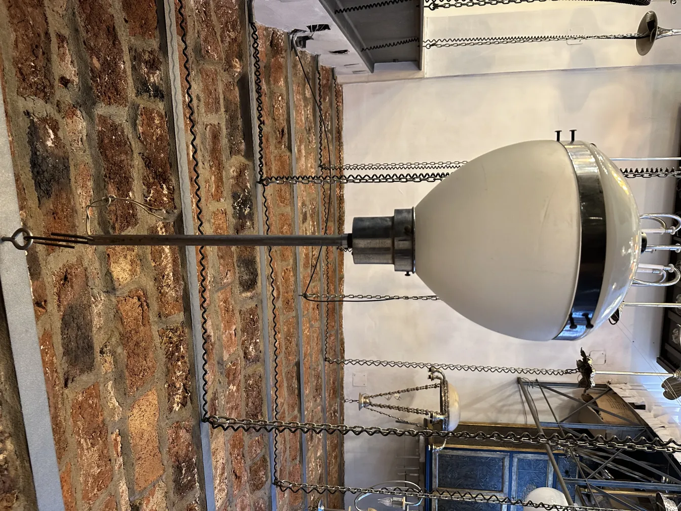 Antique hanging lamp with a unique and elegant design in a rustic setting.