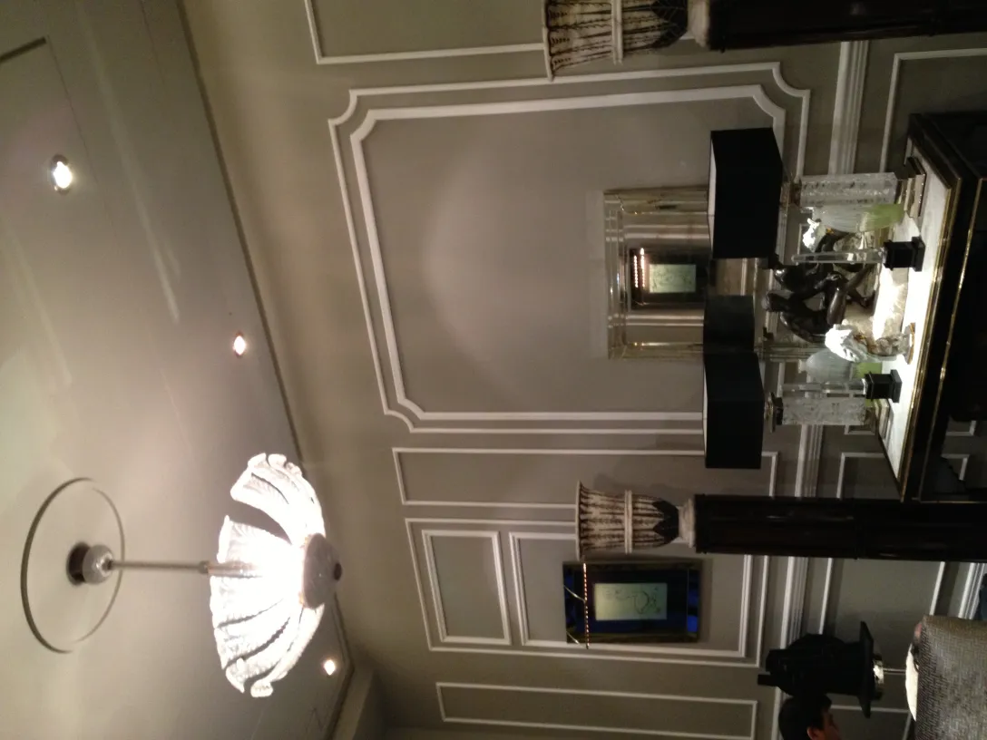 Antique hanging lamp with decorative shape in an elegant setting.