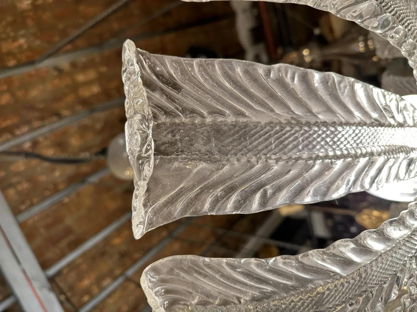 Antique hanging lamp featuring a leaf design made of glass