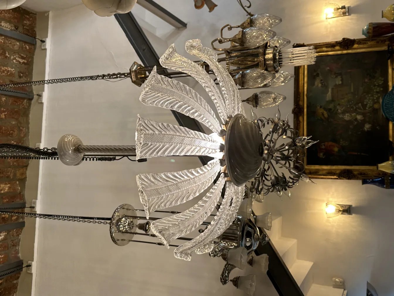 Antique hanging lamp with crystals in a classic setting.