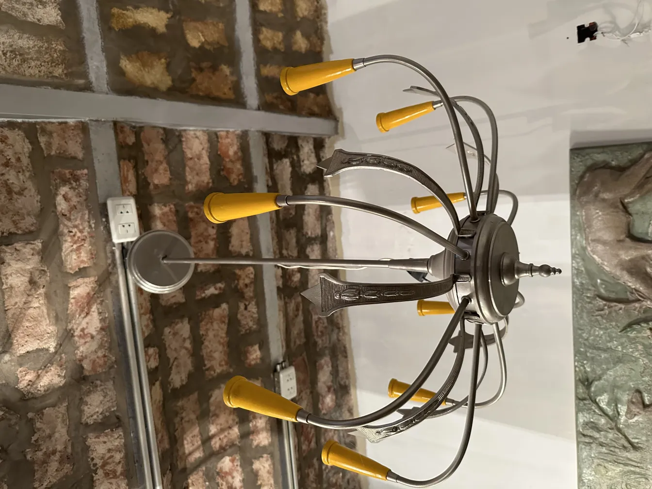 Antique hanging lamp with metal arms and yellow shades