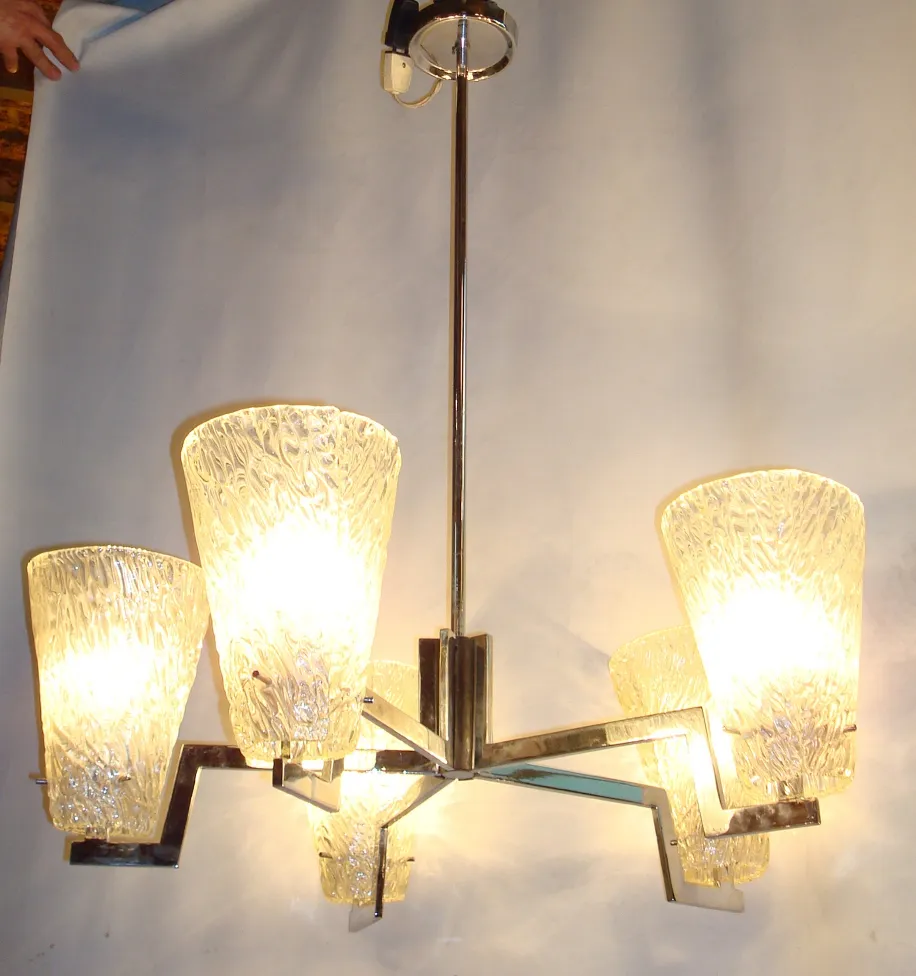 Antique hanging lamp with four warm light bulbs, elegant design