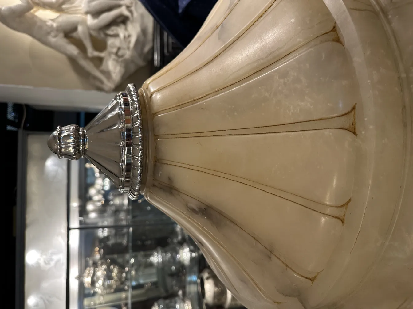 Antique hanging lamp made of alabaster with silver details.