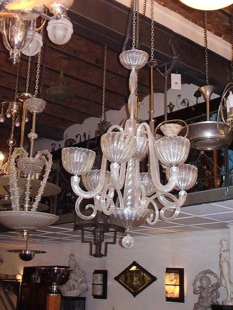 Antique hanging lamp made of glass with decorative arms