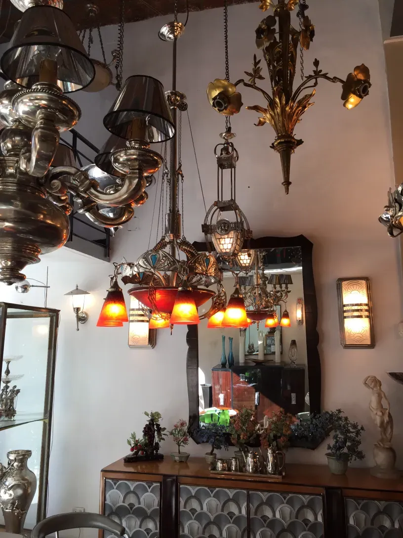 Antique hanging lamp charles schneider with bright colorful details in a vintage setting.