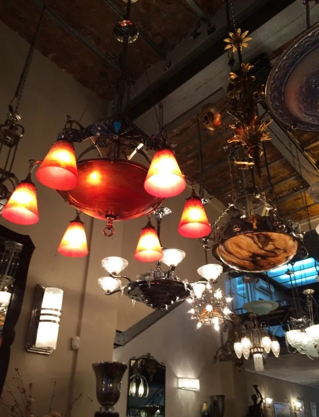 antique hanging lamp with warm light, Charles Schneider, elegant setting