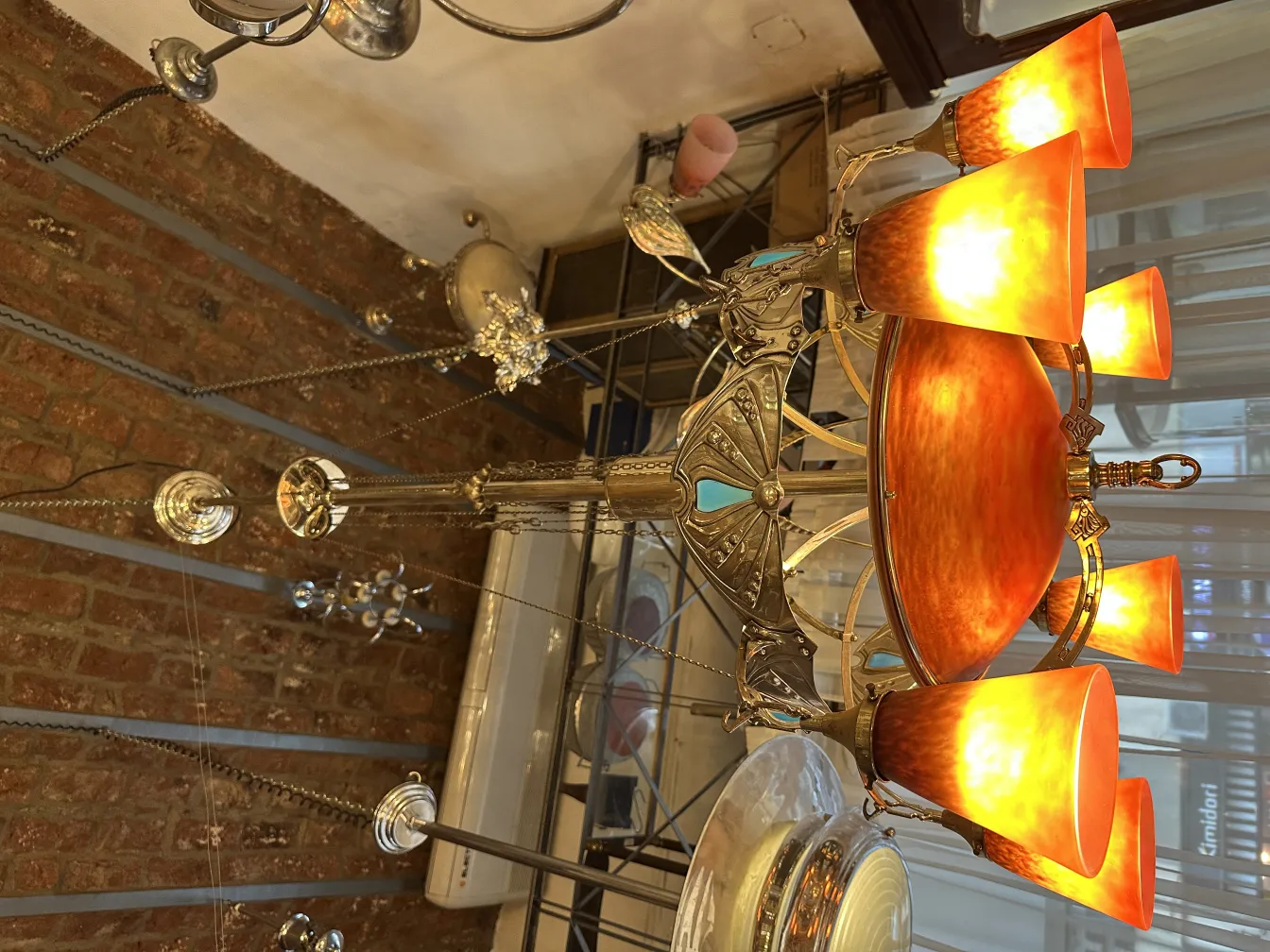 Antique hanging lamp with crystals and warm light.