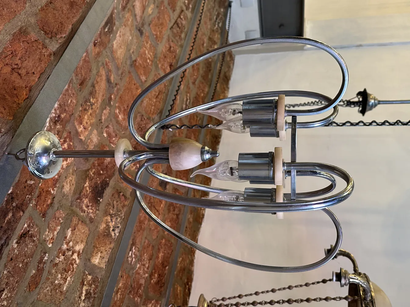 Antique hanging lamp with a modern, elegant design, surrounded by a cozy atmosphere.