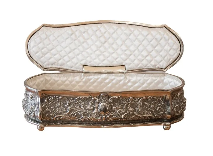 Antique box with intricate design and soft interior