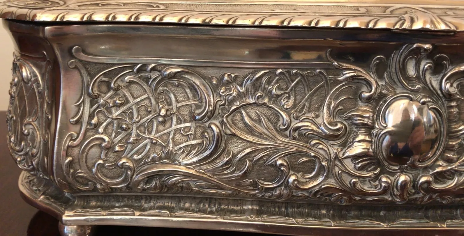 Antique decorative box featuring intricate carved reliefs